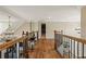 Spacious foyer with hardwood floors, a modern chandelier, and iron railing leading to the upper level at 714 Billings Farm Ln, Canton, GA 30115