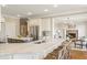 Bright, open kitchen with large island, counter seating, and view of the living room at 714 Billings Farm Ln, Canton, GA 30115