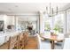 Bright, open kitchen with a large island, modern appliances, and a view into the inviting living room at 714 Billings Farm Ln, Canton, GA 30115