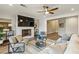 Cozy living room featuring a fireplace, ceiling fan, and comfortable seating arrangement at 714 Billings Farm Ln, Canton, GA 30115