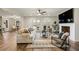 Open living room featuring stylish seating, natural light, and a ceiling fan at 714 Billings Farm Ln, Canton, GA 30115