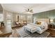 Spacious main bedroom featuring a large bed, windows, and a ceiling fan, creating a relaxing retreat at 714 Billings Farm Ln, Canton, GA 30115
