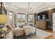 Spacious main bedroom with tray ceilings, large windows, and a decorative chandelier at 714 Billings Farm Ln, Canton, GA 30115