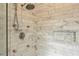 The shower features marble subway tiles and a built-in niche, alongside dual showerheads and glass doors at 714 Billings Farm Ln, Canton, GA 30115