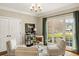 Comfortable sitting area with plush armchairs, large window with an exterior view, and stylish decor at 714 Billings Farm Ln, Canton, GA 30115
