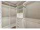 Walk-in closet with custom shelving, drawers, and hanging rods providing efficient storage solutions at 714 Billings Farm Ln, Canton, GA 30115