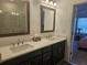 Bathroom vanity featuring dual sinks, ample counter space, and contemporary fixtures at 1309 Bennett Creek Ovlk, Suwanee, GA 30024