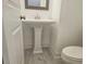 Bathroom featuring a pedestal sink, contemporary fixtures, and modern finishes at 1309 Bennett Creek Ovlk, Suwanee, GA 30024