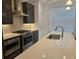 Modern kitchen featuring stainless steel appliances, elegant countertops, and ample cabinet space at 1309 Bennett Creek Ovlk, Suwanee, GA 30024