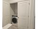 Laundry closet with washer and white bi-fold doors at 1309 Bennett Creek Ovlk, Suwanee, GA 30024