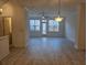 Bright living room featuring lots of natural light with stylish light fixtures and contemporary flooring at 1309 Bennett Creek Ovlk, Suwanee, GA 30024