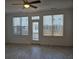 Bright living room featuring lots of natural light with stylish light fixtures and contemporary flooring at 1309 Bennett Creek Ovlk, Suwanee, GA 30024