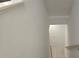 Staircase with white walls and wood-look flooring at 1309 Bennett Creek Ovlk, Suwanee, GA 30024