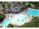 Aerial view of community pools with splash pad, lounging areas, and well-maintained landscaping at 208 Village Overlook # J3, Canton, GA 30114