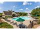 Relaxing community pool area featuring numerous lounge chairs, umbrellas, and manicured green spaces at 208 Village Overlook # J3, Canton, GA 30114