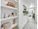 Bright hallway features built-in shelving, stylish decor, and seamless transition between living spaces at 208 Village Overlook # J3, Canton, GA 30114
