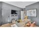 Stylish home office with gray walls, modern furniture, and a TV for a comfortable and productive workspace at 208 Village Overlook # J3, Canton, GA 30114