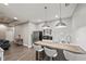 Stylish bar area with barstool seating, stainless steel appliances, and modern lighting at 2995 Barimore, Dacula, GA 30019