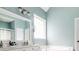Bright bathroom with a double sink vanity, garden tub, and natural light at 2995 Barimore, Dacula, GA 30019