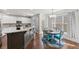 Bright kitchen features stainless appliances, white cabinets, granite counters, and a breakfast nook at 2995 Barimore, Dacula, GA 30019