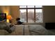Comfortable bedroom with a cozy bed and large windows providing natural light and a view at 333 Nelson Sw St # 214, Atlanta, GA 30313