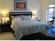 Cozy bedroom featuring a comfortable bed, bedside tables, and a window at 333 Nelson Sw St # 214, Atlanta, GA 30313