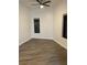 Bright bedroom features sleek hardwood floors, neutral paint, modern ceiling fan, and natural light at 333 Nelson Sw St # 214, Atlanta, GA 30313