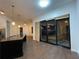 Open-concept kitchen with a large island, sleek appliances, and sliding doors to the outside at 333 Nelson Sw St # 214, Atlanta, GA 30313