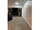 Living room with access to balcony, features wood floors and sliding glass doors at 333 Nelson Sw St # 214, Atlanta, GA 30313