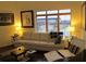 Bright living room features large windows, neutral decor, and comfortable seating at 333 Nelson Sw St # 214, Atlanta, GA 30313