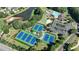 Aerial view of a community featuring tennis courts, a pool, a sand volleyball court and a parking lot at 3350 Vista Creek Dr, Dacula, GA 30019