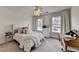 A cozy bedroom provides a comfortable bed and a dedicated desk space at 3350 Vista Creek Dr, Dacula, GA 30019
