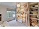 Charming bedroom featuring cozy bunk beds with soft, decorative curtains and built-in shelving at 3350 Vista Creek Dr, Dacula, GA 30019
