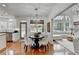 Bright dining area featuring modern chandelier, hardwood floors, and white chairs at 3350 Vista Creek Dr, Dacula, GA 30019