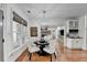 Open concept dining area with hardwood floors and modern chandelier at 3350 Vista Creek Dr, Dacula, GA 30019