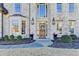 Charming brick home with a grand two-story entrance, manicured landscaping, and elegant front door at 3350 Vista Creek Dr, Dacula, GA 30019