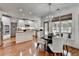 Bright kitchen with stainless appliances, white cabinetry, kitchen island and adjacent dining area at 3350 Vista Creek Dr, Dacula, GA 30019