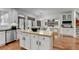 Open kitchen featuring stainless appliances, a central butcher block island and hardwood floors at 3350 Vista Creek Dr, Dacula, GA 30019