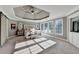 Spacious main bedroom features tray ceilings, neutral tones, and large windows with natural light at 3350 Vista Creek Dr, Dacula, GA 30019