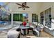 Inviting outdoor seating area under a covered patio, perfect for relaxing and enjoying the serene surroundings at 3350 Vista Creek Dr, Dacula, GA 30019