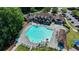 Aerial view of a community pool with lounge chairs, umbrellas, and a meticulously kept lawn at 3350 Vista Creek Dr, Dacula, GA 30019