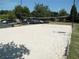 Sand volleyball court with a net set up and greenery in the background at 3350 Vista Creek Dr, Dacula, GA 30019