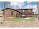 Backyard view with a wooden deck and mature trees at 1511 Womack Rd, Atlanta, GA 30338