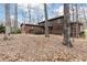 Spacious backyard with a wooden deck and mature trees at 1511 Womack Rd, Atlanta, GA 30338