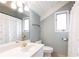 Bathroom with a white vanity, toilet, and shower/tub combination at 1511 Womack Rd, Atlanta, GA 30338