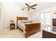 Cozy bedroom with vaulted ceiling, ceiling fan, large window, and wood furnishings at 1511 Womack Rd, Atlanta, GA 30338