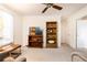 Bedroom featuring neutral carpet, ceiling fan, and built in shelving at 1511 Womack Rd, Atlanta, GA 30338