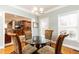 Cozy breakfast nook featuring a round glass table, upholstered chairs, and natural light at 1511 Womack Rd, Atlanta, GA 30338