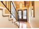 Inviting entryway with hardwood floors, elegant lighting, and an ornate staircase at 1511 Womack Rd, Atlanta, GA 30338