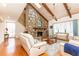 Bright living room with stone fireplace, vaulted ceiling, and hardwood floors at 1511 Womack Rd, Atlanta, GA 30338